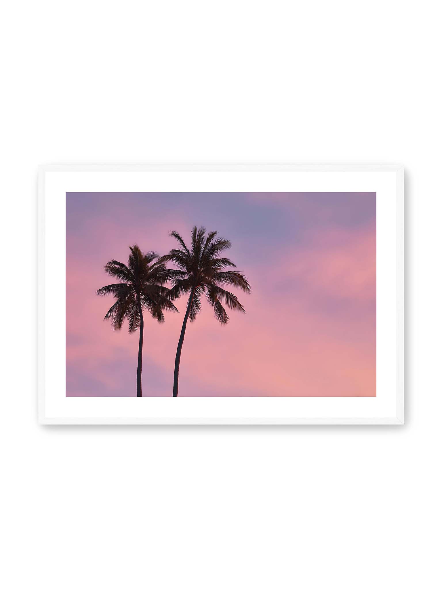 70x100 cm, weißer Galerie-Rand, weißer Rahmen – Zwei Palmen als dunkle Silhouetten vor einem rosafarbenen Himmel mit weichen Farbverläufen bei Sonnenuntergang.